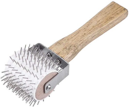 Needle uncapping roller